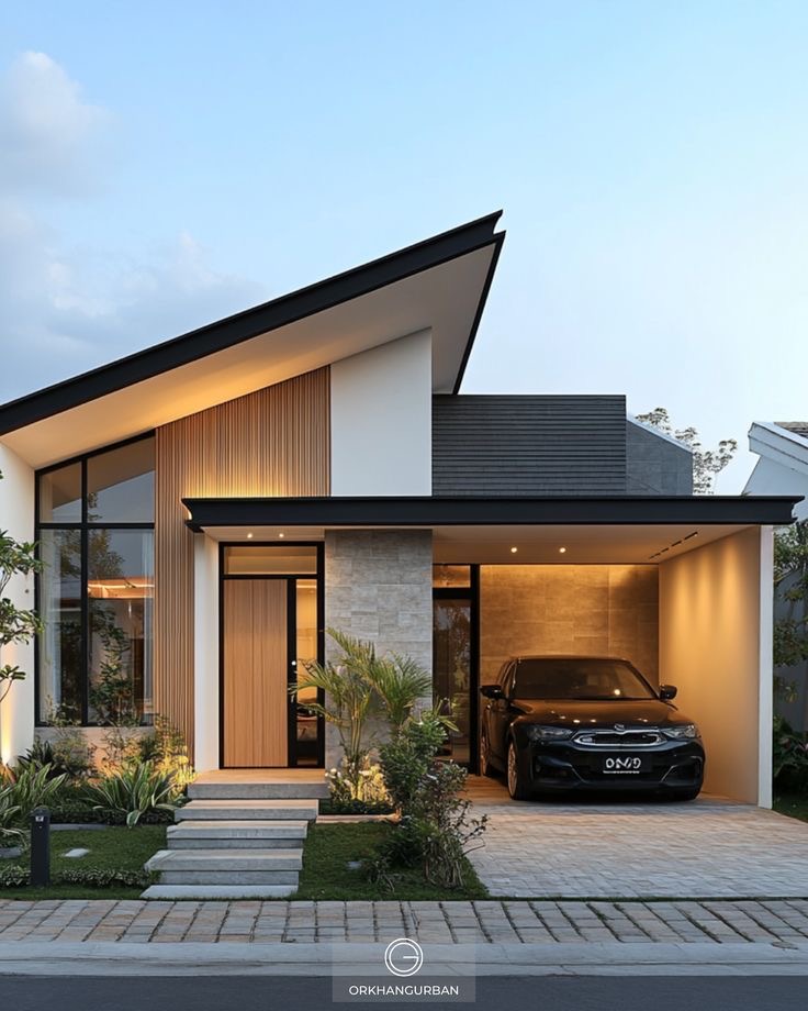 Modern single-storey home with timber cladding and illuminated carport