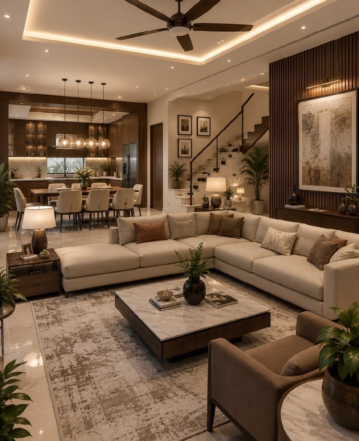 Warm open-plan living interior with sectional sofa and marble table